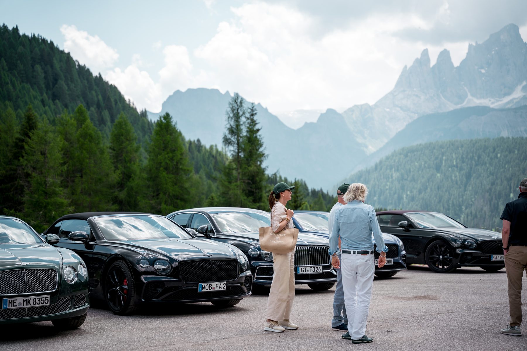 Participants admire the line-up of Bentleys against a sweeping Dolomite panorama
