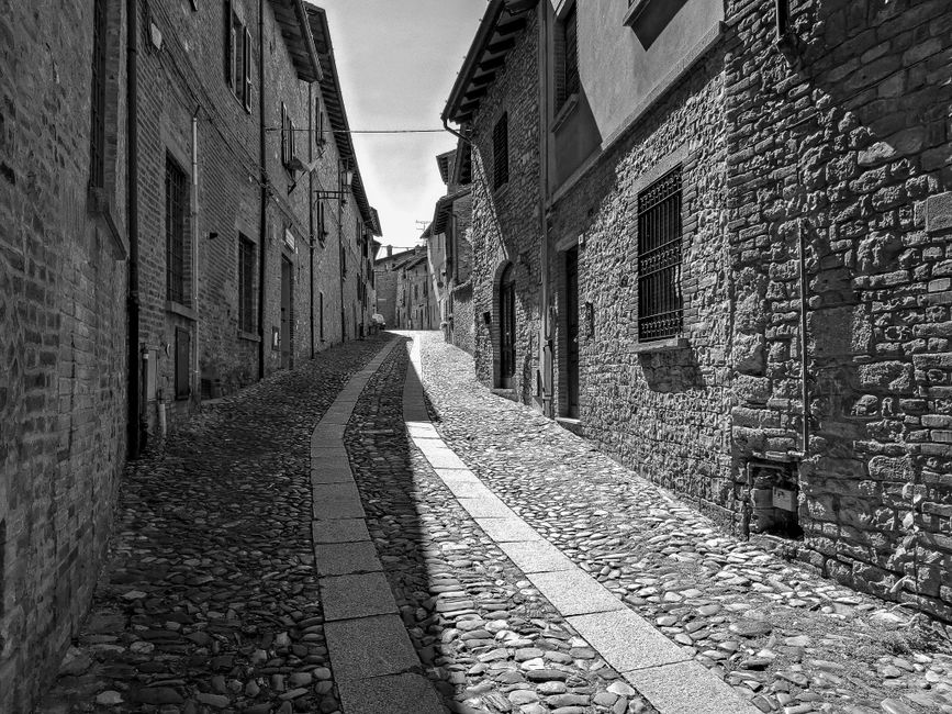 You discover a simple historic interior of stone and wood.
